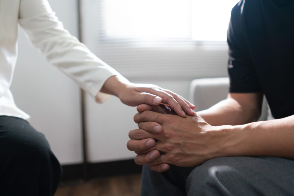 Pschologist woman touching hands