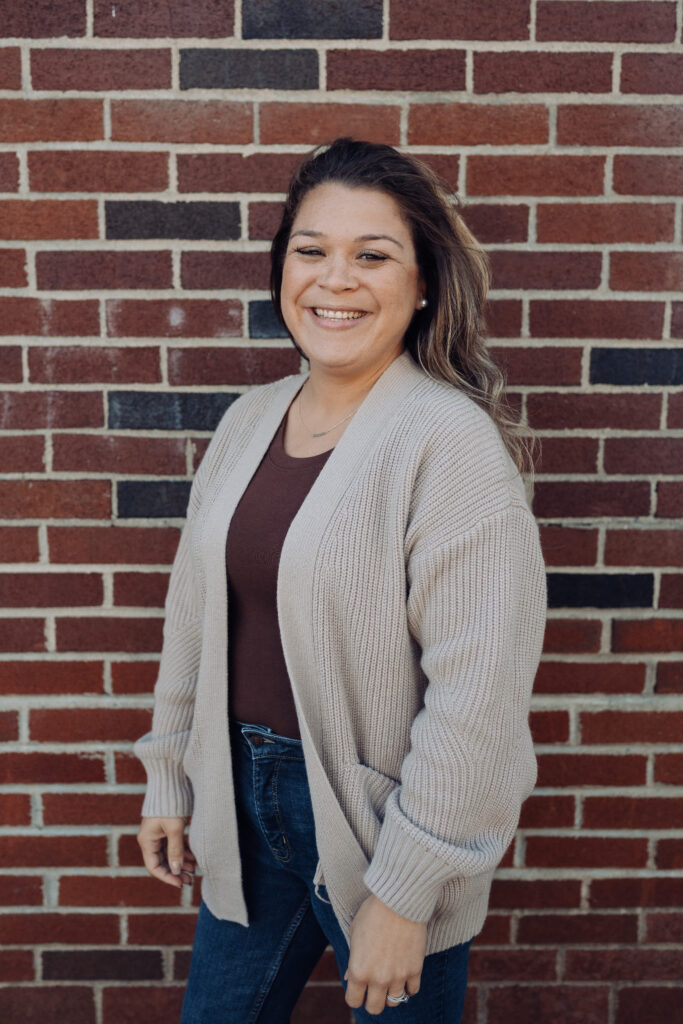 Picture of Alura Trotman with a Brick Background