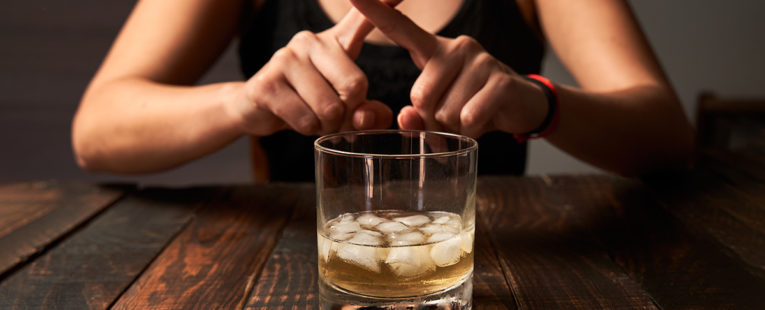 A glass of alcohol crossed out, emphasizing the importance of avoiding alcohol while taking low dose naltrexone.